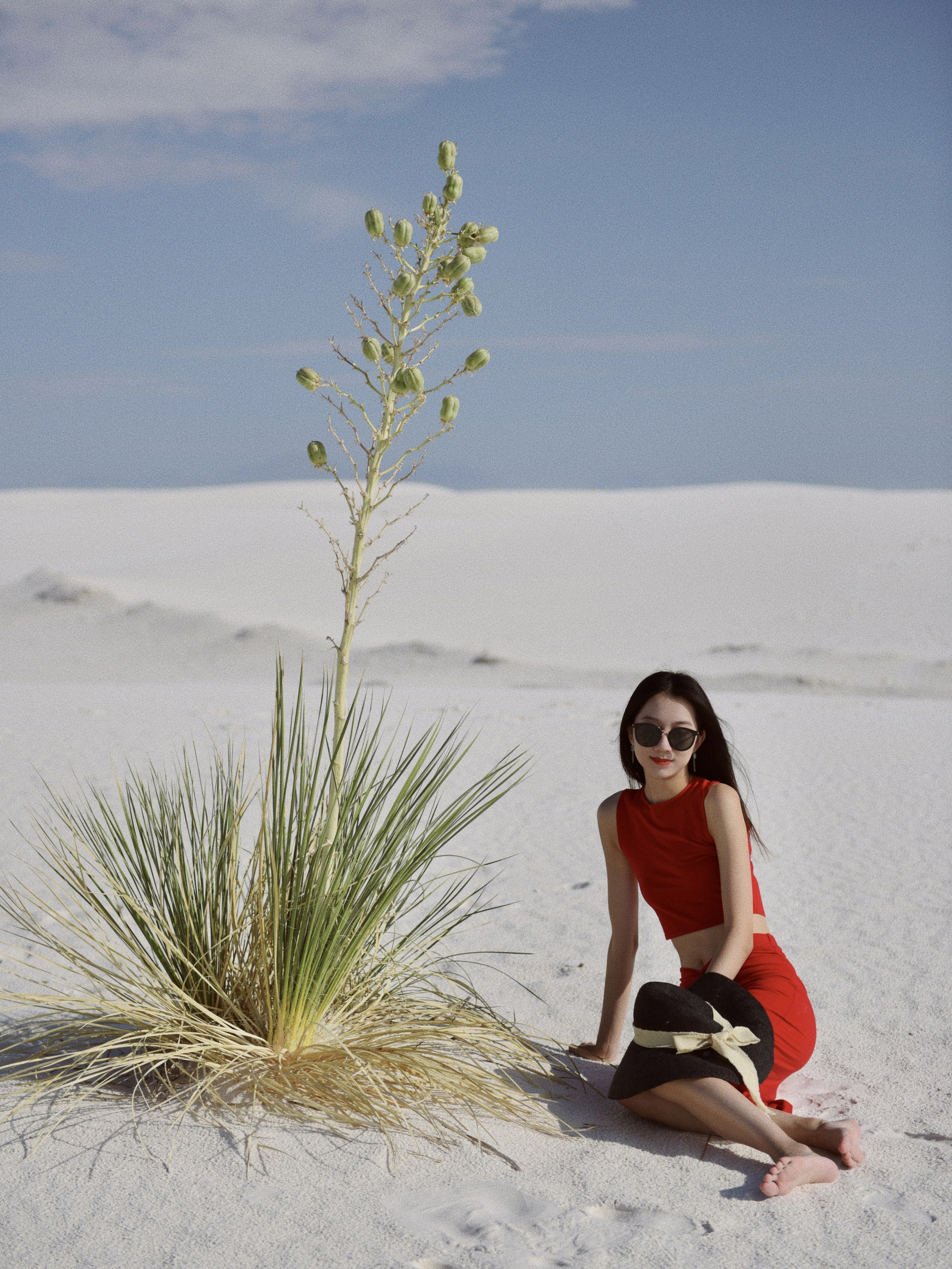 The girl with red outfit walking in White Sand National Park